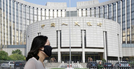 Ekonomistler Çin'in büyüme tahminlerini düşürdü