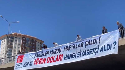 CHP'li Başarır, köprüye astığı pankartla sordu: Aylık 10 bin doları hangi siyasetçi aldı?