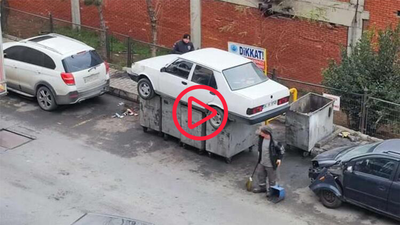 İş yerinin önünü kapatan otomobili çöpe attılar