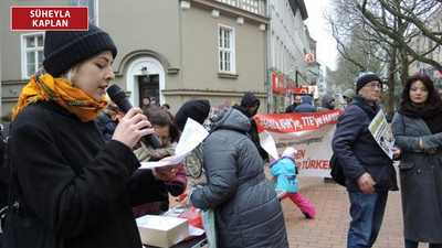 Almanya'da OHAL ve 'tek tip elbise' dayatmasına karşı protesto