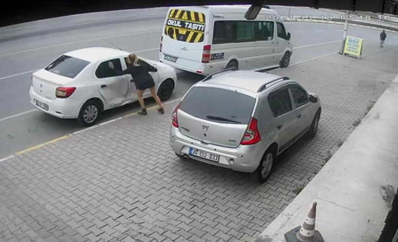 Erkek şiddetine maruz kalan kadın, eşinin aracını parçaladı